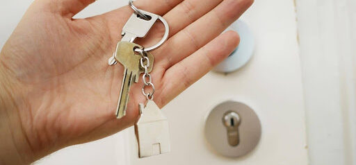 homeowner holds keys to new house after divorce KHM Attorneys at Law Colorado Springs, Castle Rock