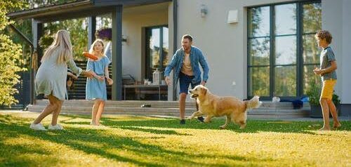 co-parenting in action with man, woman, two children and dog in backyard KHM Attorneys at Law Colorado Springs, Castle Rock