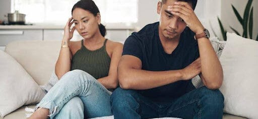 man and woman both with hands on their foreheads are struggling to communicate KHM Attorneys at Law Colorado Springs, Castle Rock