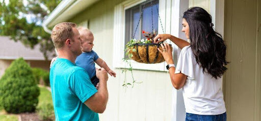 young man and woman are co-parenting their toddler while working in the backyard KHM Attorneys at Law Colorado Springs, Castle Rock