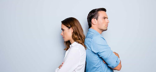 man and woman with backs to each other and are both angry KHM Attorneys at Law Colorado Springs, Castle Rock