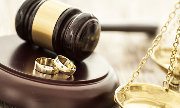 gavel, two wedding rings, and legal scale KHM Attorneys at Law Colorado Springs, Castle Rock