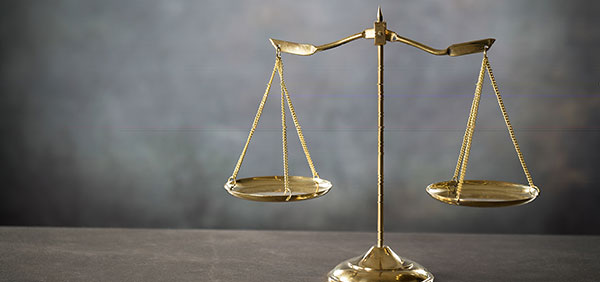 picture of gold balanced legal scale KHM Attorneys at Law Colorado Springs, Castle Rock